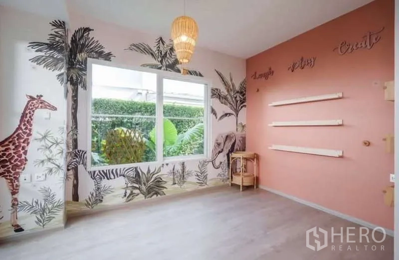 Detached House for rent in Prawet, Bangkok - Creative playroom with pastel wall mural, pendant light and wide window.