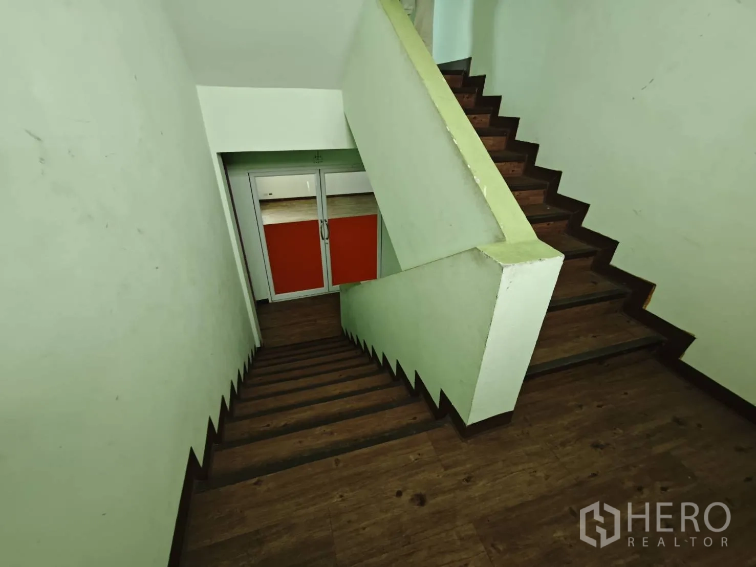 Office Space for rent in Prawet, Bangkok - Internal staircase with wood steps leading to glass double doors.