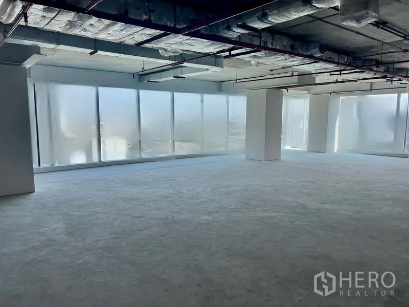 Office Space for rent in Sathon, Bangkok - Corner office space with panoramic window walls, exposed HVAC and abundant natural light near BTS Chong Nonsi.