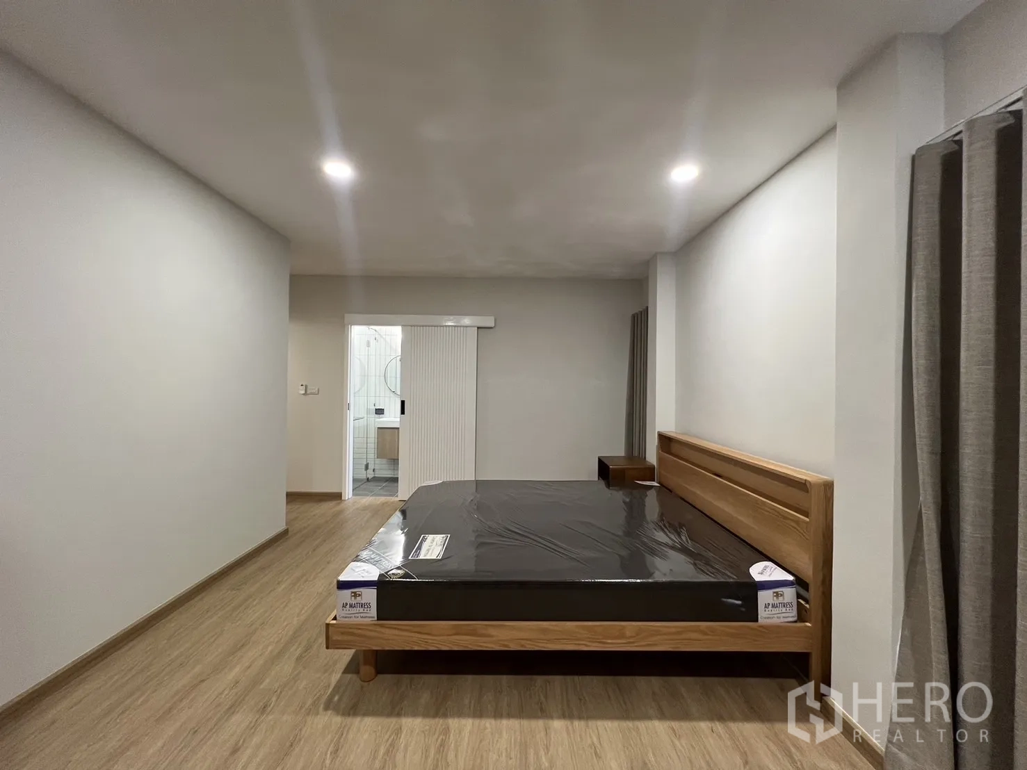 Detached House for rent in Saphan Sung, Bangkok - Master bedroom view toward the ensuite bathroom entrance.