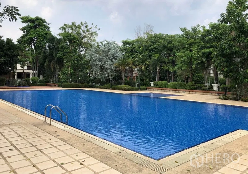 Detached House for rent in Saphan Sung, Bangkok - Another angle of the large lap pool with entry steps and surrounding gardens.