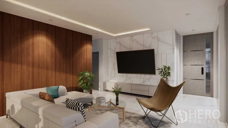 ที่ดิน ขายในPrawet, Bangkok - ห้องนั่งเล่นสมัยใหม่ โซฟา L‑shape ผนังหินอ่อนติดทีวีและผนังไม้ตกแต่ง.