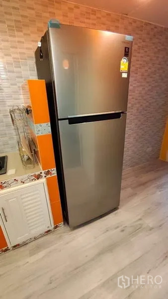 Detached House for rent in Bang Phli, Samut Prakan - Stainless steel refrigerator in a tiled kitchen.
