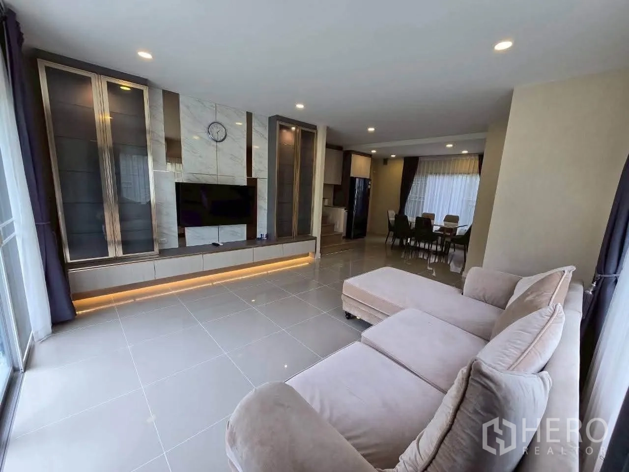 Detached House for rent or sale in Lat Krabang, Bangkok - Front exterior of two-storey detached house with balcony, carport, and lawn.