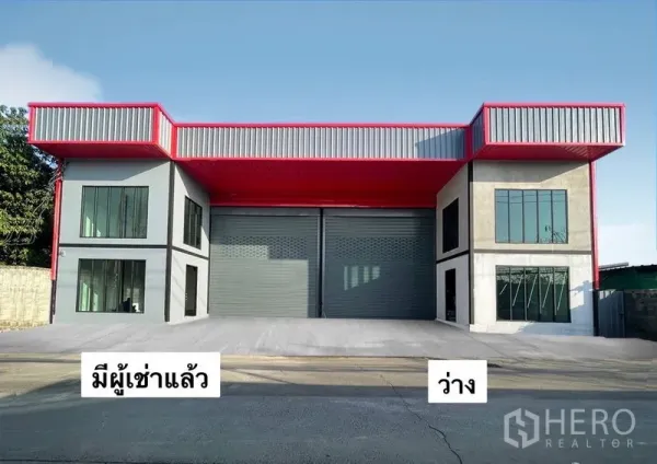 Warehouse for rent in Bang Kapi, Bangkok - Modern dual-bay warehouse exterior in Bang Kapi with red canopy, wide roller shutters and a spacious loading apron.