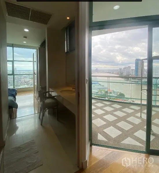 Condominium for rent in Bang Kho Laem, Bangkok - Hallway to bathroom and glass door opening to a balcony with river view.