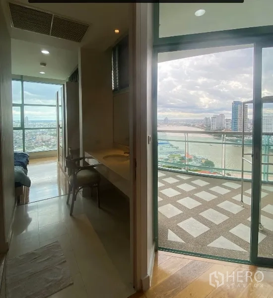 Condominium for rent in Bang Kho Laem, Bangkok - Hallway to bathroom and glass door opening to a balcony with river view.