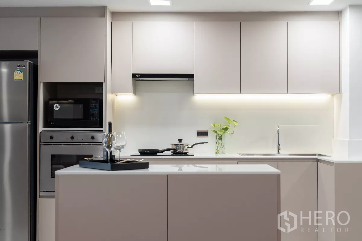 Apartment for rent - Sleek kitchen island with under-cabinet lighting and ample storage.