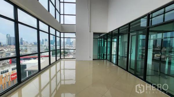 Office Space for rent in Yan Nawa, Bangkok - Large office area with glass partitions and panoramic skyline of Bangkok.