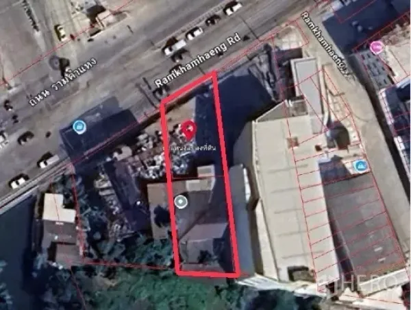 Land for sale in Bang Kapi, Bangkok - Aerial map view highlighting a long rectangular land parcel outlined in red beside a main city roadway.