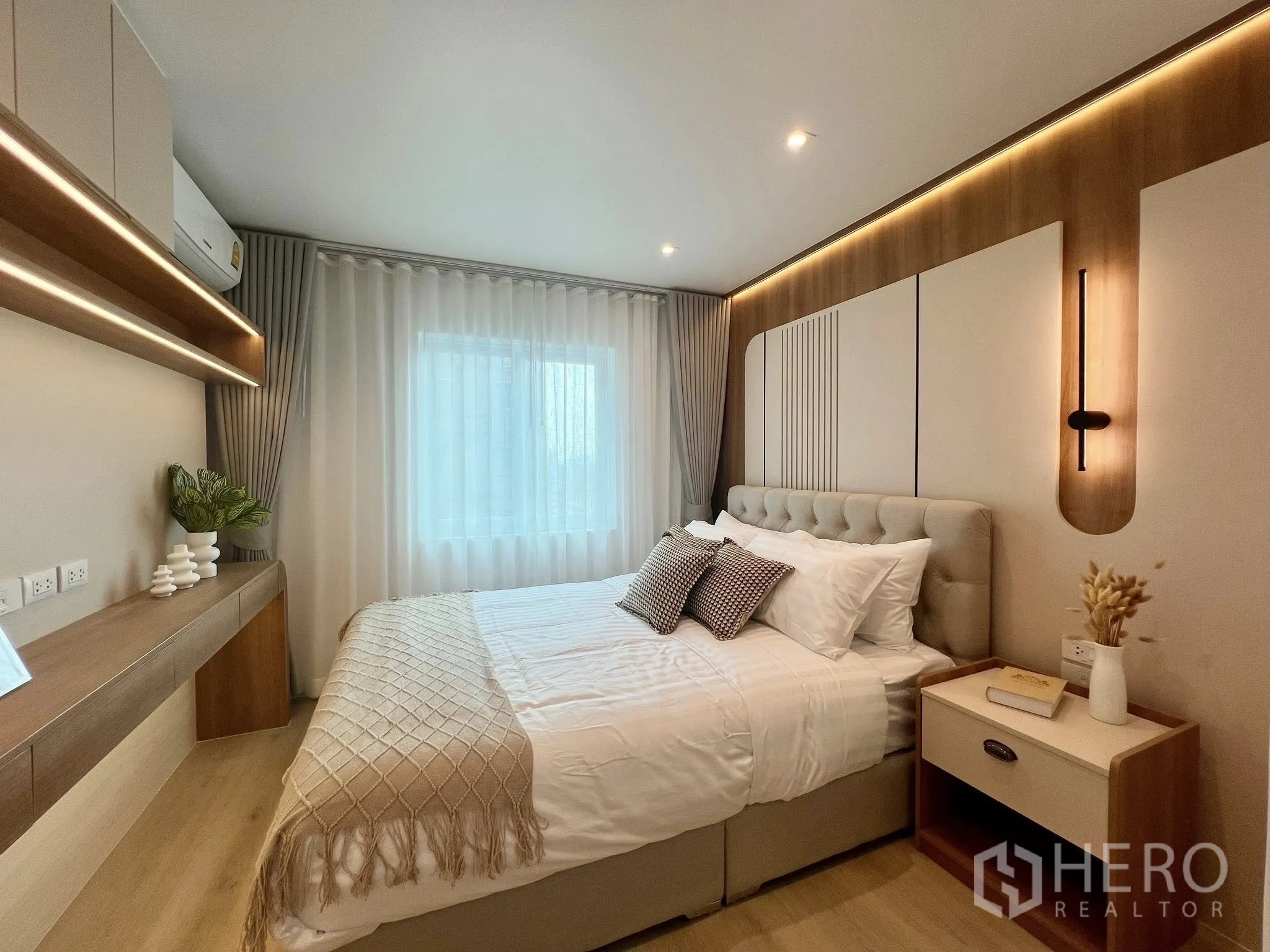 Condominium for rent or sale in Yan Nawa, Bangkok - Bedroom view showing floating shelves with LED strip lighting and a large curtained window.