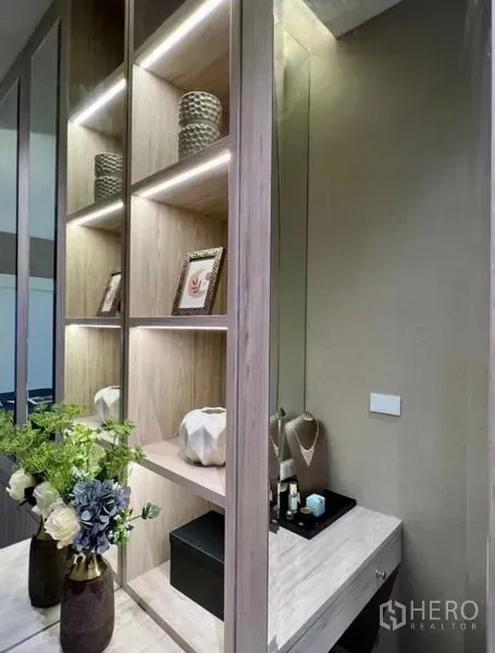Detached House for sale in Bang Phli, Samut Prakan - Built-in illuminated shelving and vanity dressing area with mirror and floral decor.