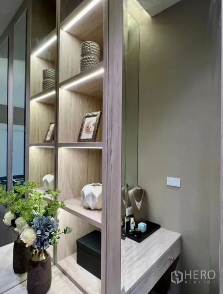 Detached House for sale in Bang Phli, Samut Prakan - Built-in illuminated shelving and vanity dressing area with mirror and floral decor.