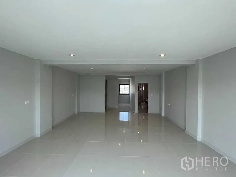 Home Office for rent - Expansive open-plan floor with glossy tiles and ceiling spotlights, ready for office layout.