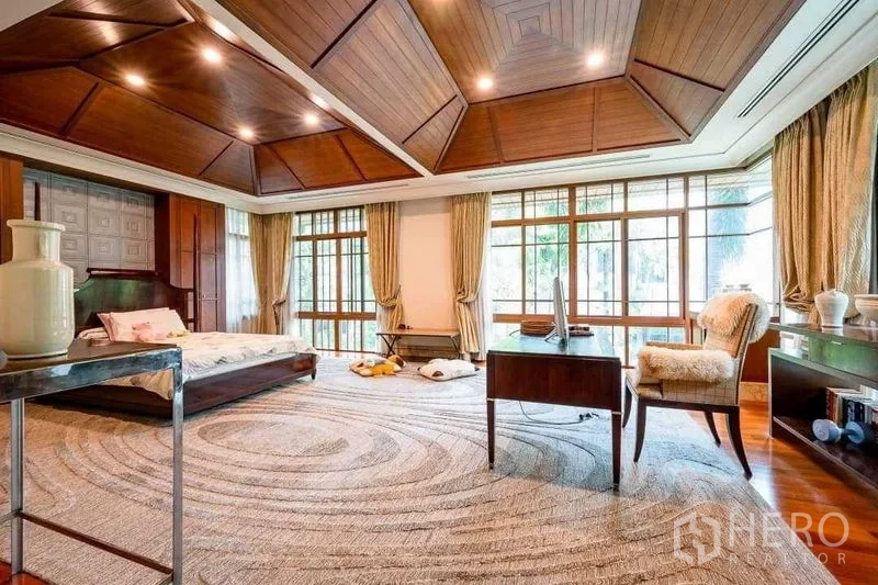 Detached House for sale - Expansive master suite with wood ceiling, rug and study desk by windows.