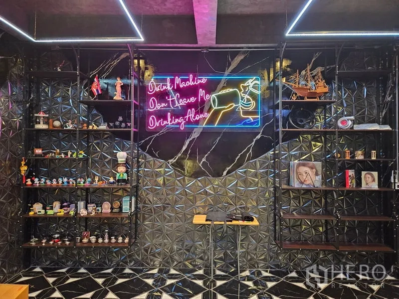 Detached House for sale in Thawi Watthana, Bangkok - Stylish hobby bar room with neon sign, shelving and geometric wall tiles.