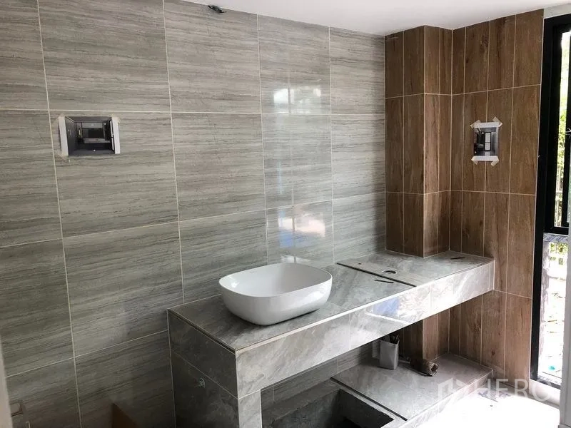 Office Space for rent in Lat Krabang, Bangkok - Contemporary bathroom with stone countertop, vessel sink and tiled walls.