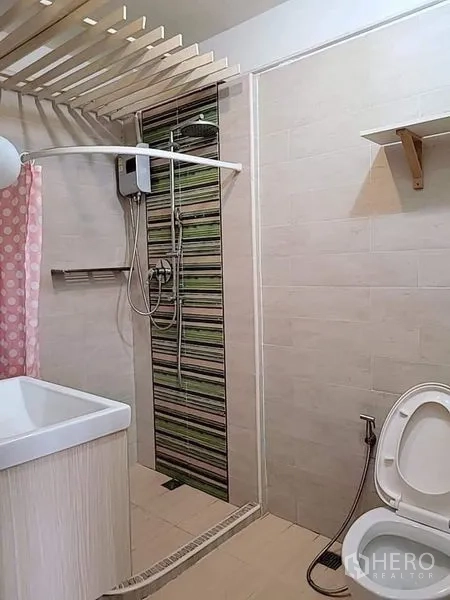 Detached House for rent - Bathroom with tiled shower, water heater, vanity and bidet spray.