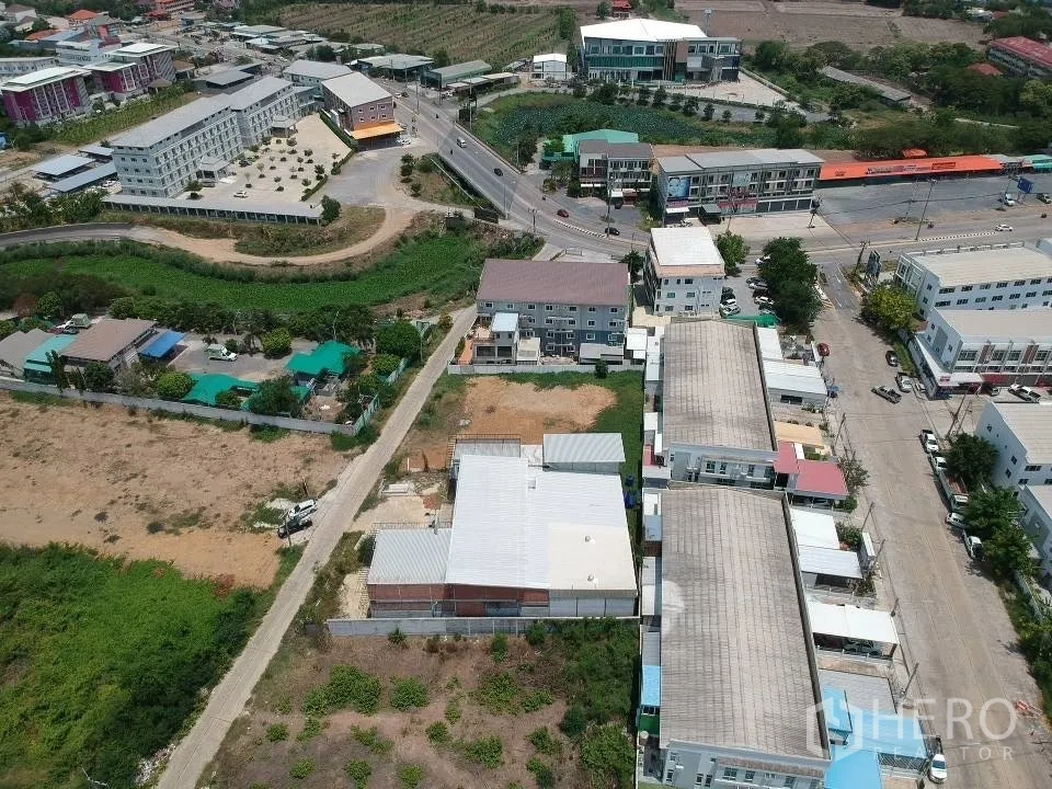 Land for sale in Phra Nakhon Si Ayutthaya, Phra Nakhon Si Ayutthaya - Wide drone view highlighting the site’s position near main roads and mixed‑use developments.