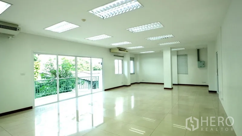 Office Space for rent in Bang Rak, Bangkok - Spacious office with large windows, multiple air conditioners and glossy tile flooring.