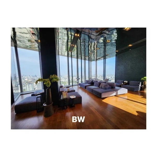 Condominium for rent in Phra Khanong, Bangkok - Sky lounge with panoramic city views and plush sofas by tall windows
