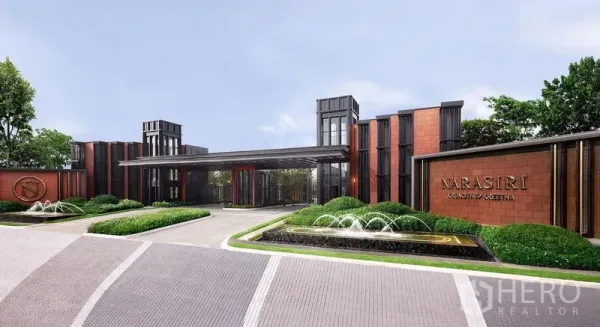 Detached House for sale in Suan Luang, Bangkok - Modern gated entrance with fountains and clubhouse at the Narasiri community in Bangkok.