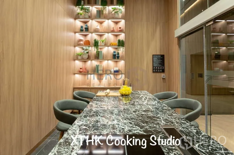 Condominium for rent or sale - Cooking studio with marble island counter and bar stools in the condominium.