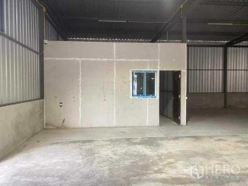 Warehouse for rent in Nong Khaem, Bangkok - Internal partitioned office room with window inside the warehouse.