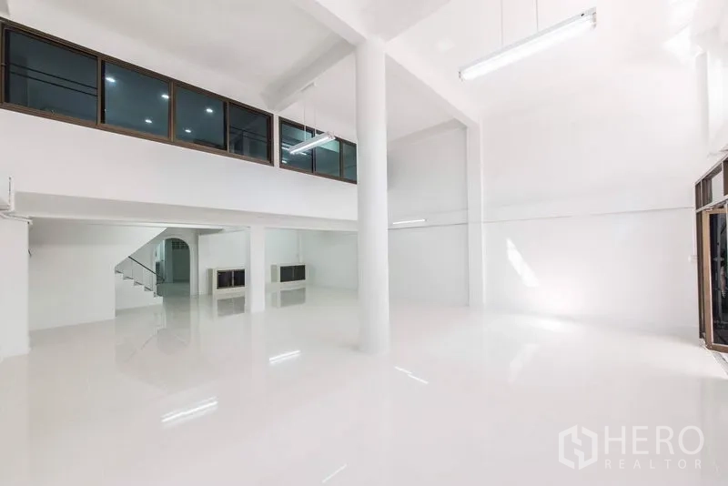 Home Office for sale in Bang Kho Laem, Bangkok - Double-height lobby-style hall with mezzanine windows and glass entry doors.