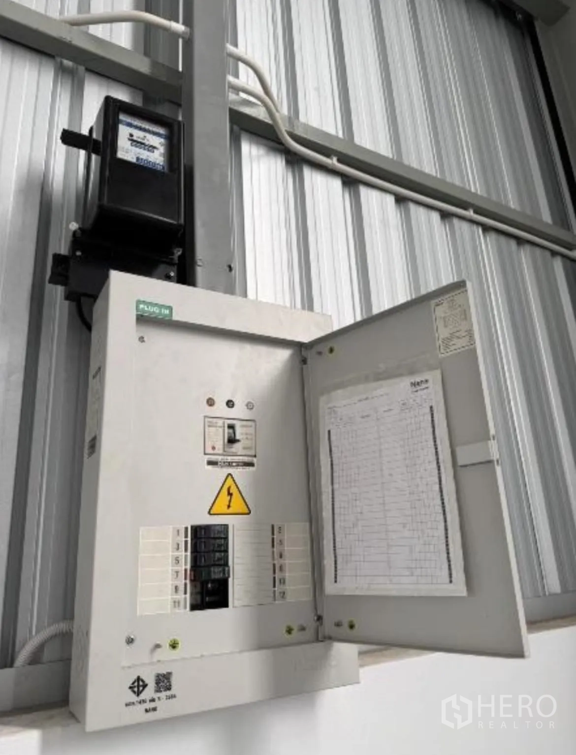 Warehouse for rent in Bang Khun Thian, Bangkok - Electrical meter and distribution panel mounted on an interior wall.