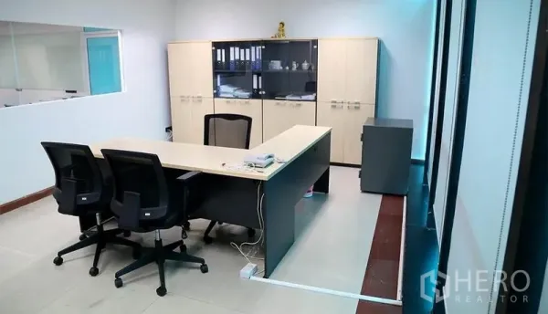 Office Space for rent in Huai Khwang, Bangkok - Executive desk with chairs and built-in storage cabinets in a private office.