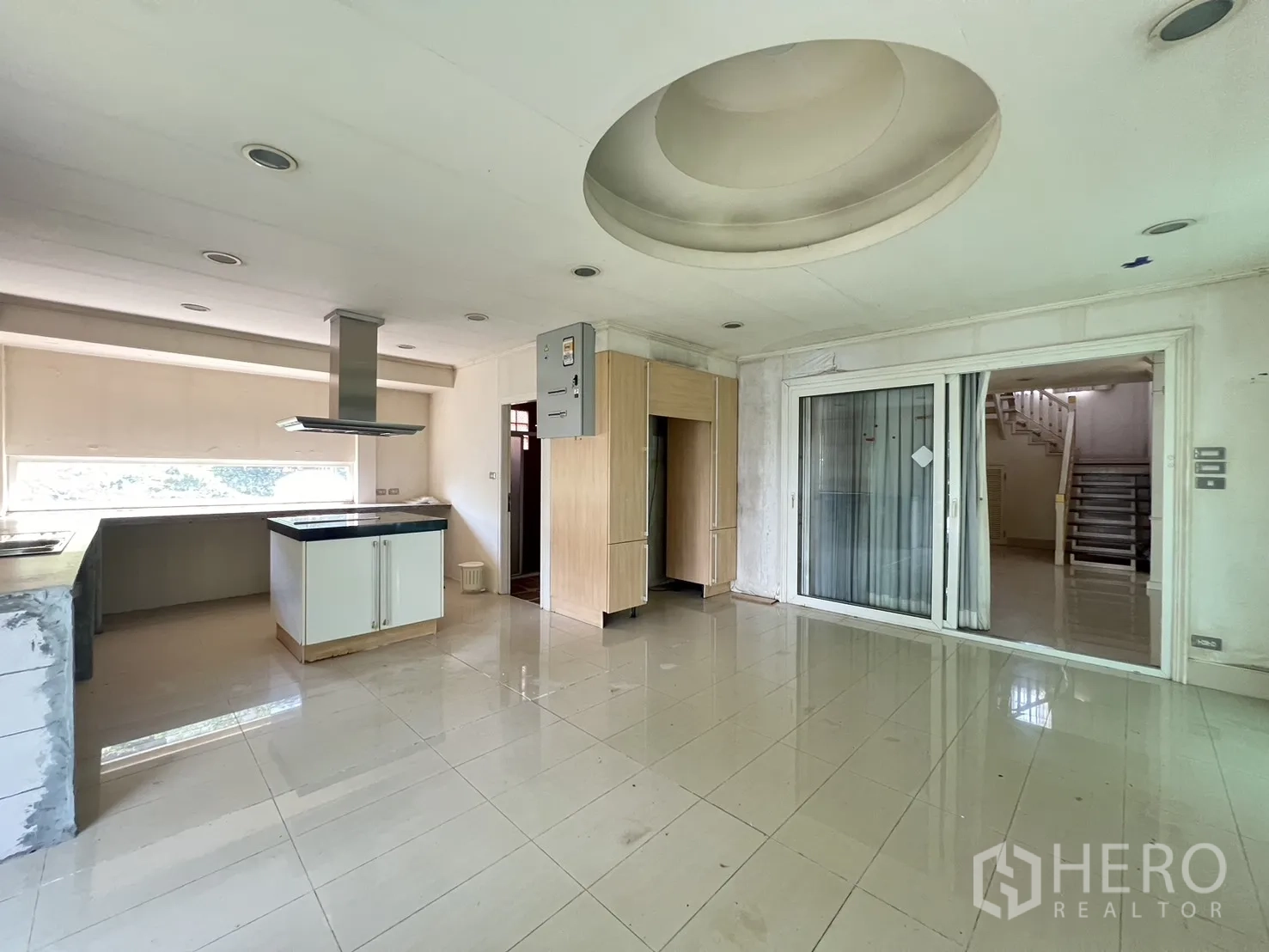 Detached House for sale in Saphan Sung, Bangkok - Spacious kitchen with island, range hood, and sliding glass door.