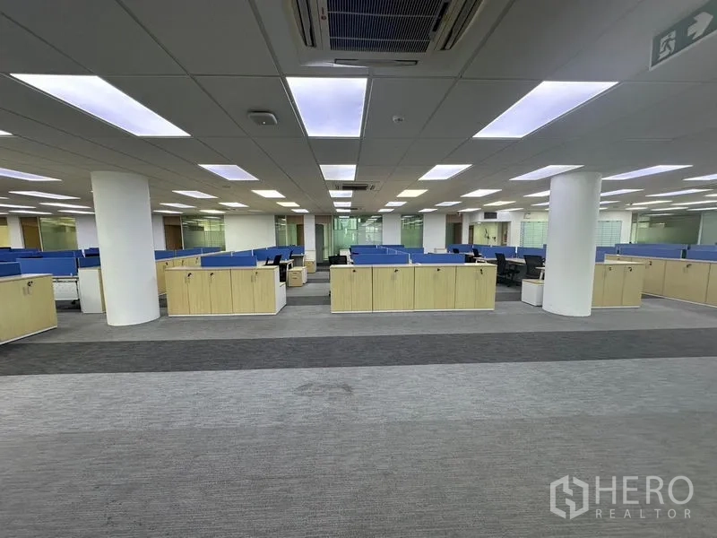 Office Space for rent - Pantry with white cabinetry, refrigerator, sink and marble-look flooring next to tall window.