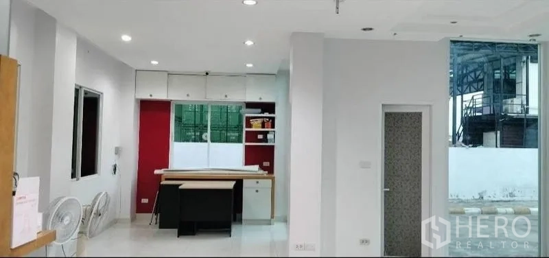 Warehouse for rent in Bang Bua Thong, Nonthaburi - Bright office interior with recessed lighting, built-in cabinetry and large windows