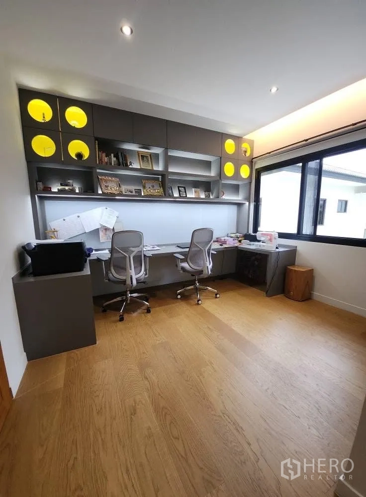 Detached House for rent in Bang Phli, Samut Prakan - Home office with custom shelving and dual workstations beside a large window.