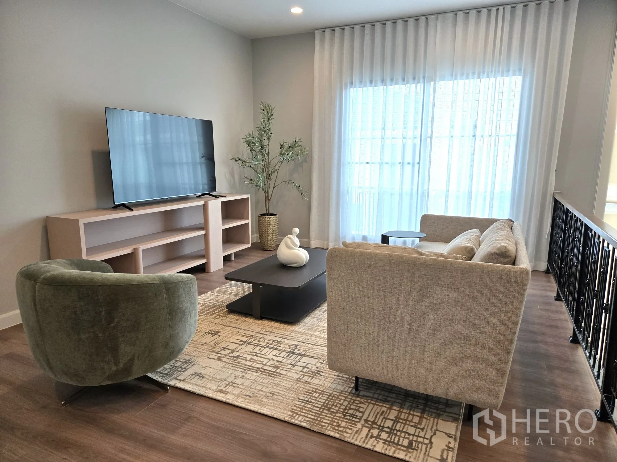 Detached House for rent in Bang Phli, Samut Prakan - Second view of family lounge with TV console and natural light.