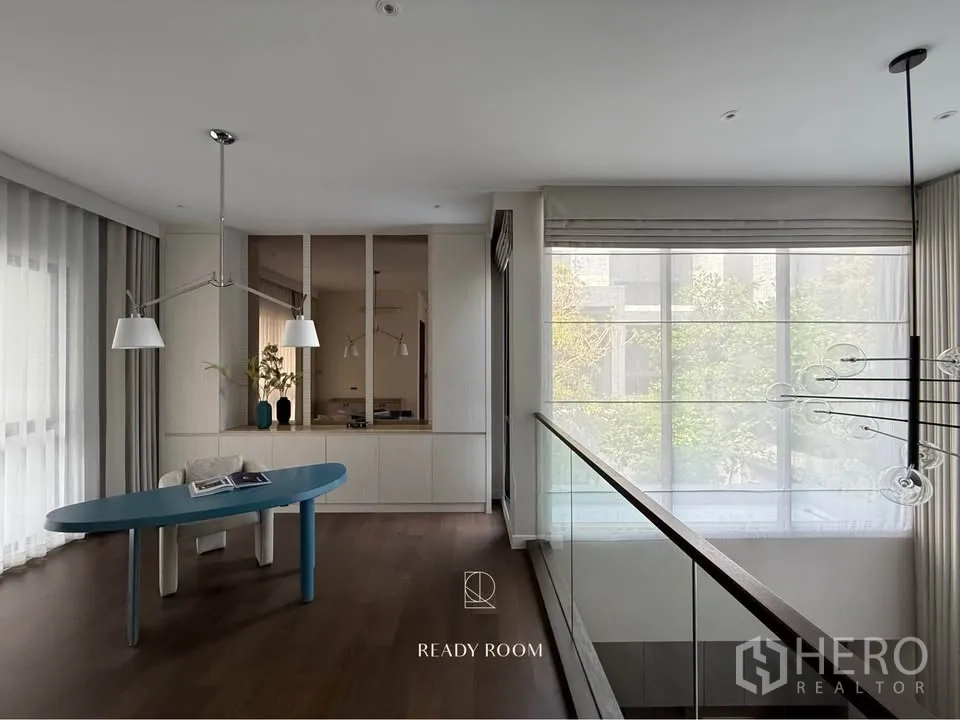Detached House for rent in Bang Kapi, Bangkok - Upper gallery with glass balustrade and sheer blinds overlooking greenery.