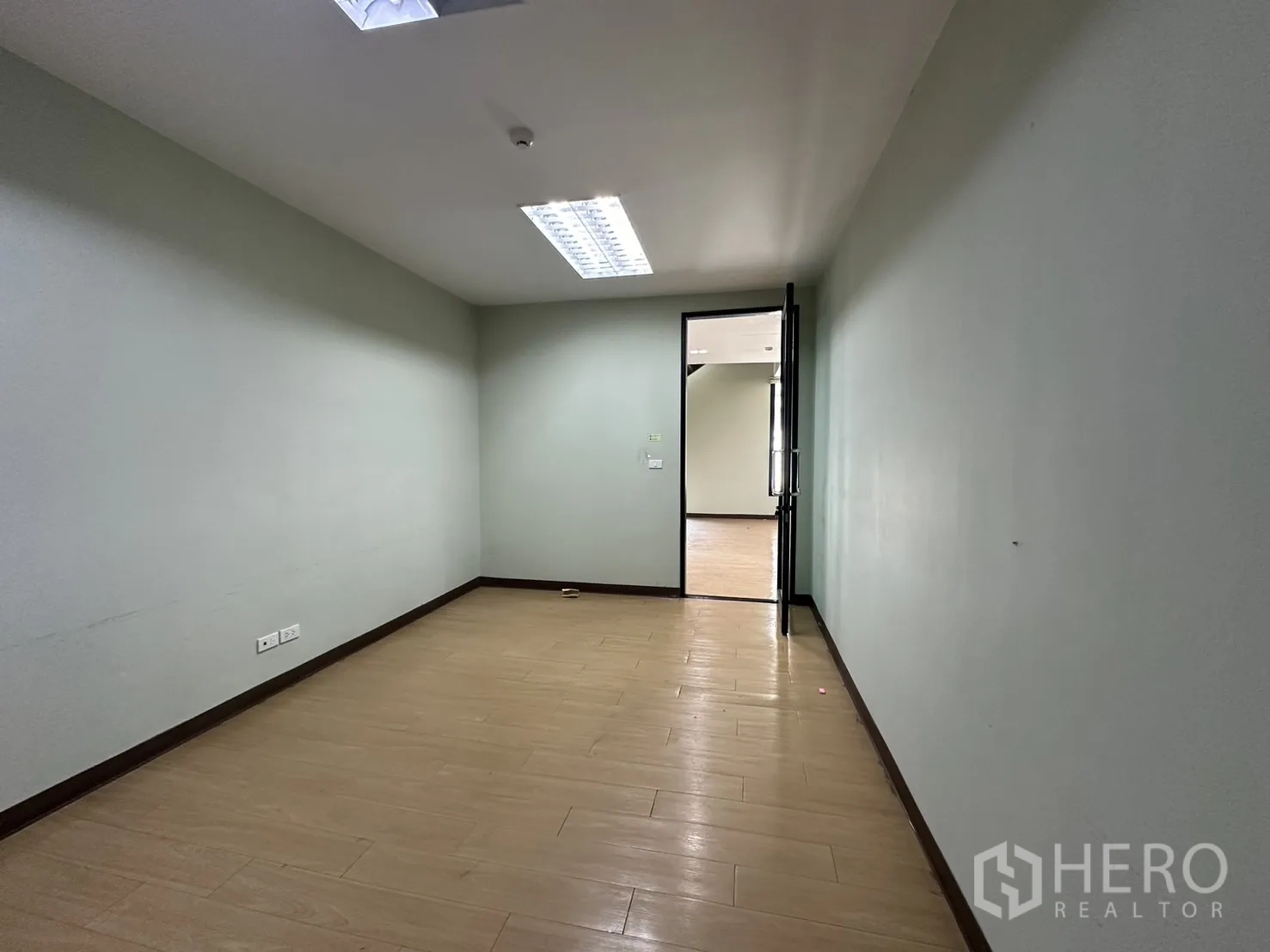 Home Office for rent in Prawet, Bangkok - Private office room with wood-look floors and a single door.