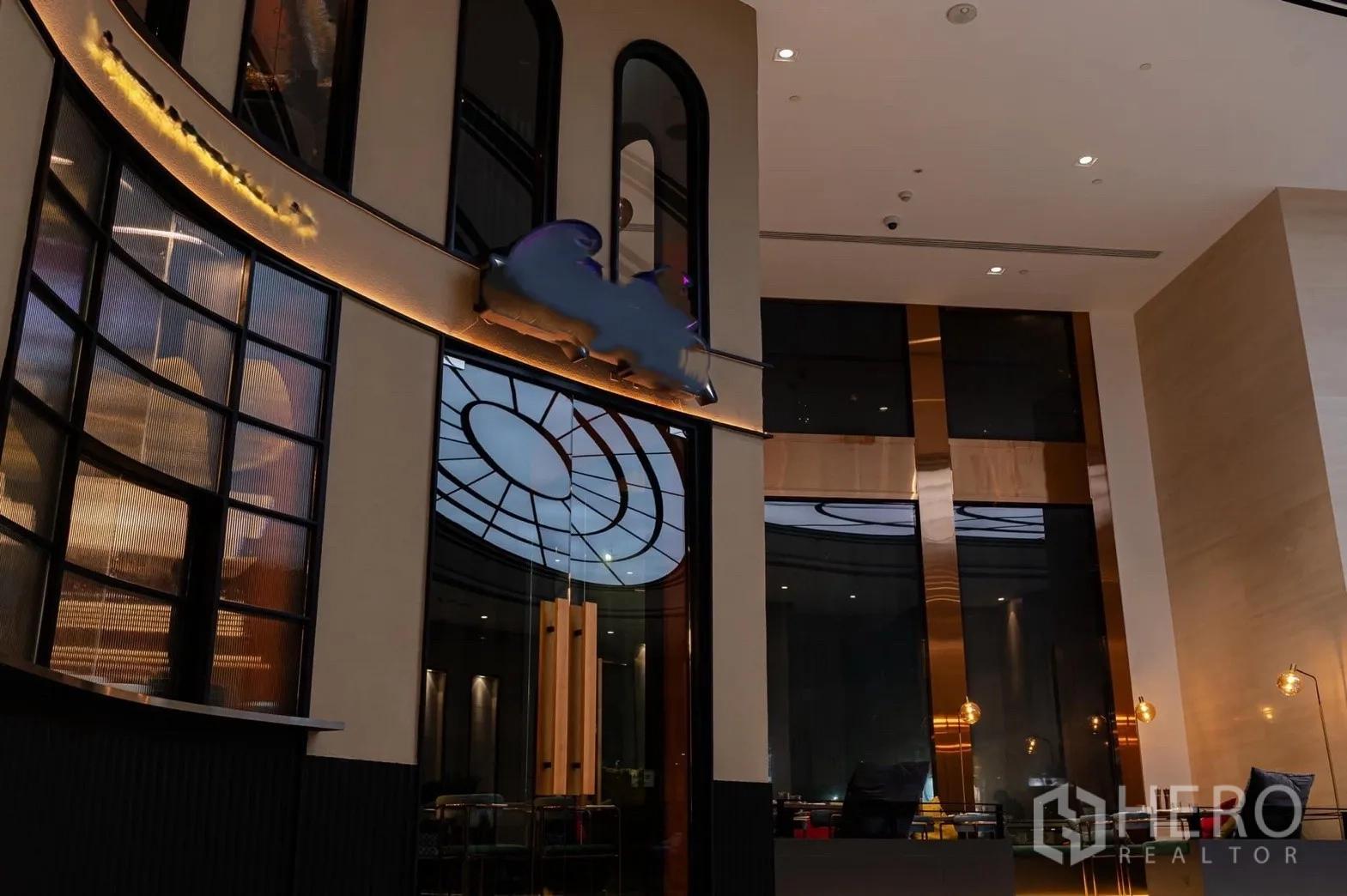 Retail Space for rent in Bang Rak, Bangkok - Interior facade with curved glass panels and a decorative circular ceiling feature.