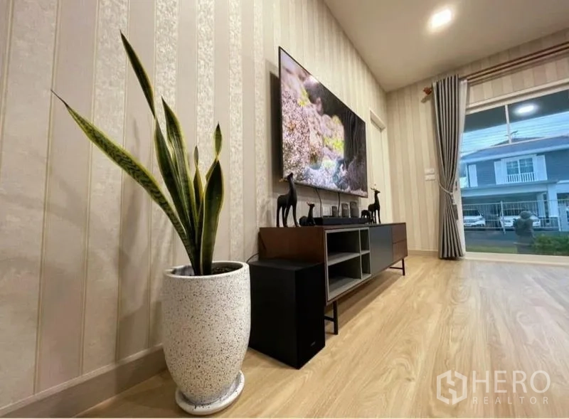 Detached House for rent or sale - TV feature wall with media console, indoor plant and floor-to-ceiling window with curtains