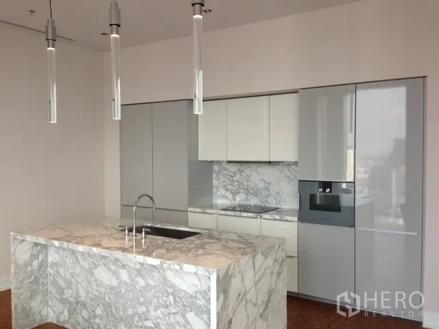 Condominium for rent or sale in Bang Rak, Bangkok - Luxury condo kitchen with marble island, pendant lights and built-in appliances at King Power Mahanakhon, Bangkok.