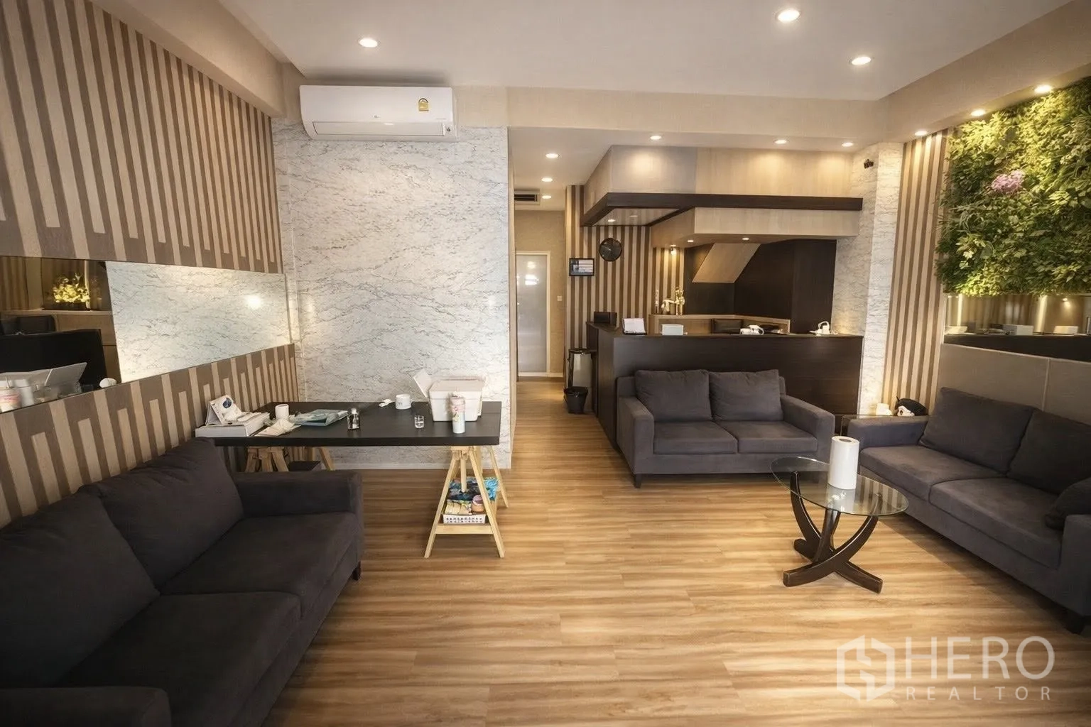 Home Office for rent or sale in Yan Nawa, Bangkok - Spacious lounge with multiple sofas, feature walls, and a reception counter.