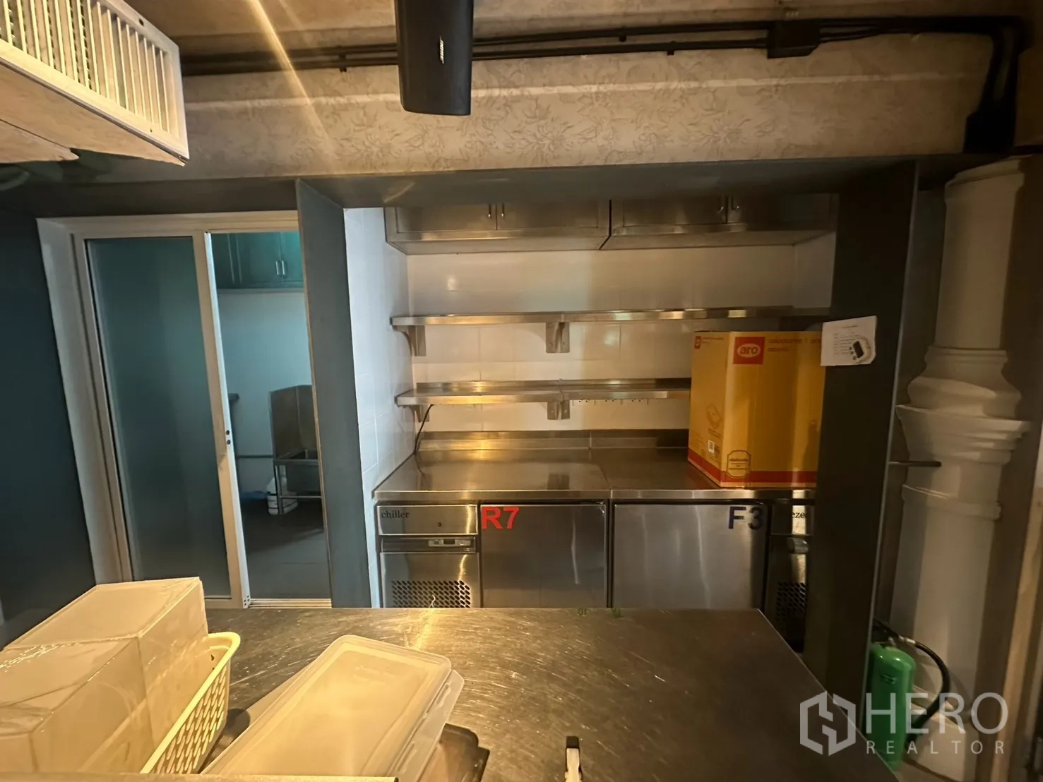 Detached House for rent in Watthana, Bangkok - Stainless pass and undercounter fridges in a commercial-style kitchen.
