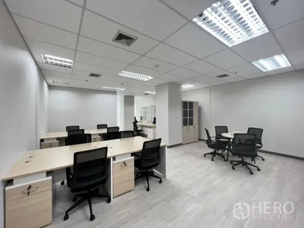 Office Space for rent in Sathon, Bangkok - Wide view of furnished office showing multiple desks, meeting nooks and cabinets.