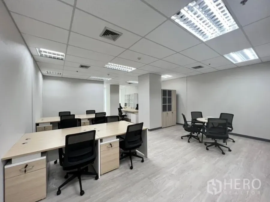 Office Space for rent in Sathon, Bangkok - Wide view of furnished office showing multiple desks, meeting nooks and cabinets.