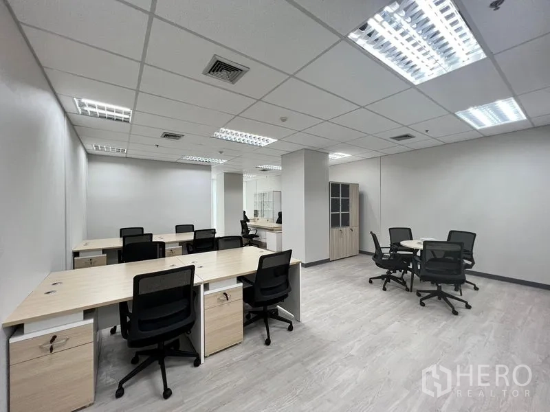 Office Space for rent in Sathon, Bangkok - Wide view of furnished office showing multiple desks, meeting nooks and cabinets.