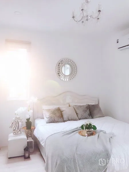 Retail Space for rent in Khlong Toei, Bangkok - Bright bedroom with a white bed, soft pillows and light streaming through the window.
