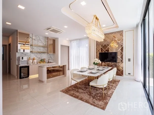 Detached House for sale in Prawet, Bangkok - Hallway with illuminated shoe display cabinetry and staircase to upper floor.