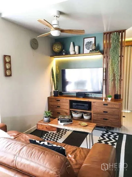 Detached House for sale in Bang Phli, Samut Prakan - TV corner with wooden console, ceiling fan and accent lighting