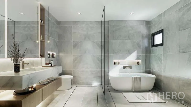 Townhouse for sale - Contemporary bathroom with freestanding bathtub, walk-in shower and long marble vanity.